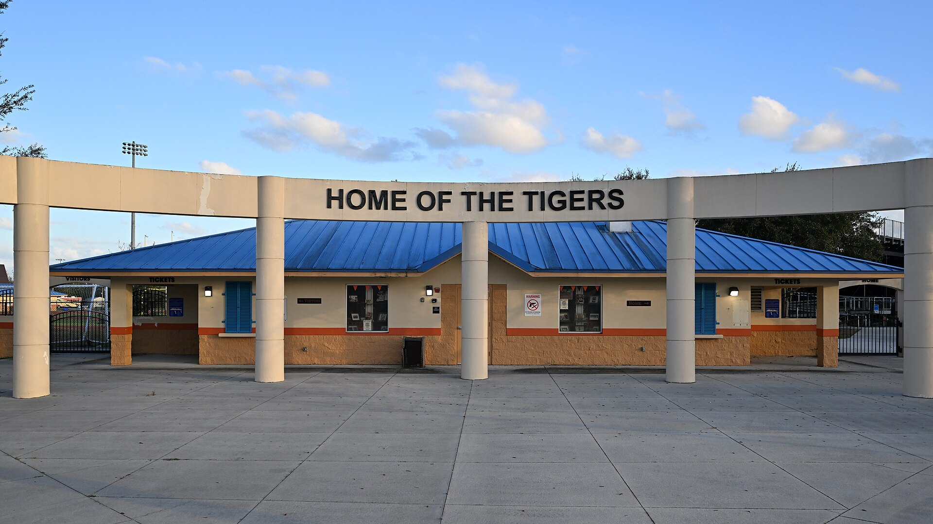 The entrance to the Cocoa High School stadium, with Home of the Tigers lettered over the gate.