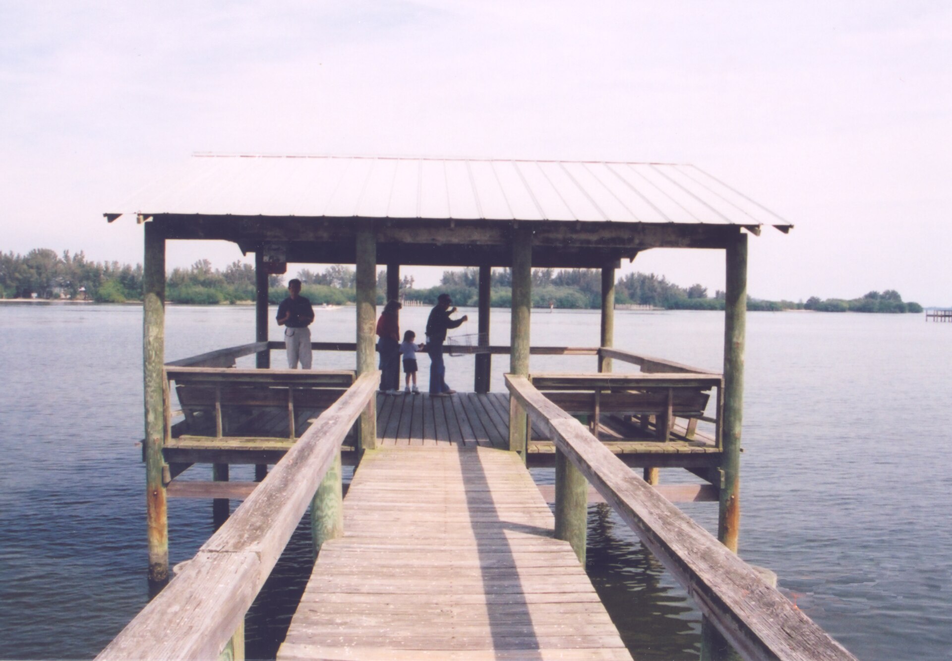 Covered pier on the Indian River Lagoon, the salt-marsh habitat that bred the mosquitoes the district was created to control.